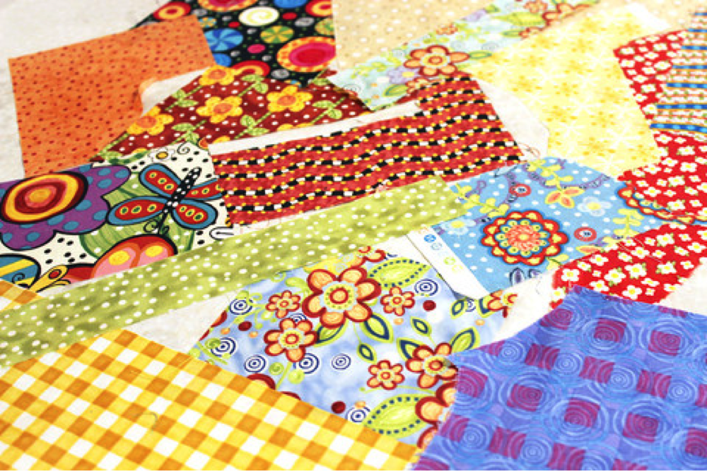 Scraps use in the scrappy trim pillow project. The Sewing Loft