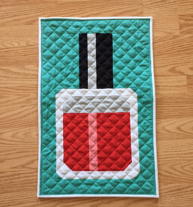 Find this Nail Polish Mini Quilt Pattern by Fat Quarter Shop and more free mini quilt patterns in this fun round up. 