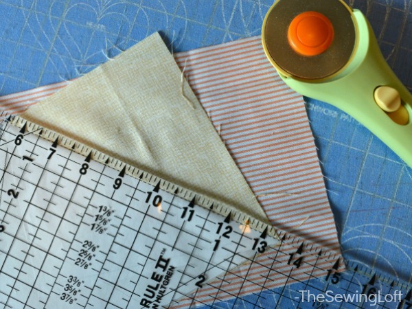Do not cut through paper template. Instead, fold template back along stitch line before cutting away excess fabric. 
