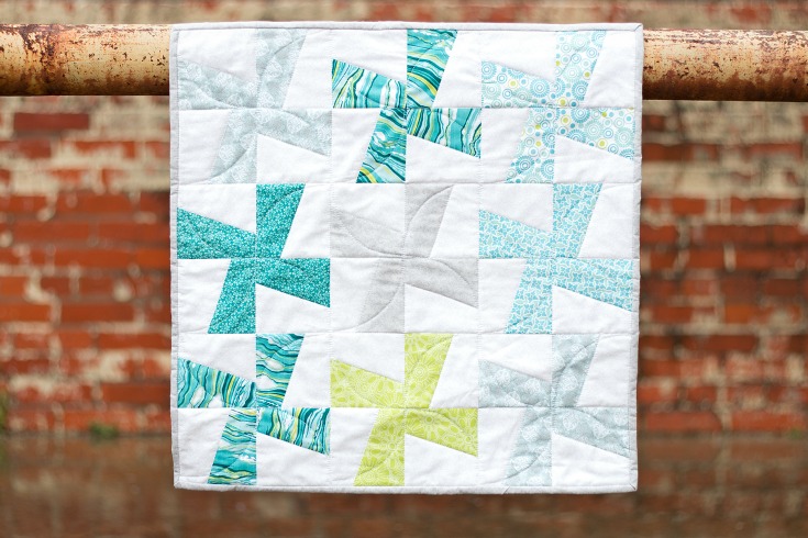 Strip piecing and templates make the Cartwheels Mini Quilt from Fabric Editions a quick and easy project. This skill builder is one that you will want to have in your tool belt- includes video.