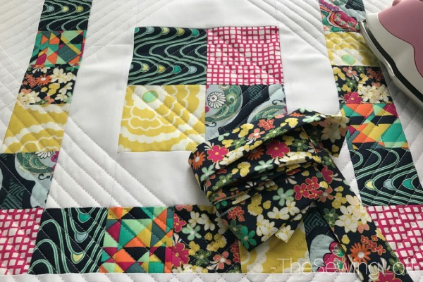 Learn how to create beautiful quilt binding with this simple DIY tip. Includes video tutorial to show you how to create this technique.