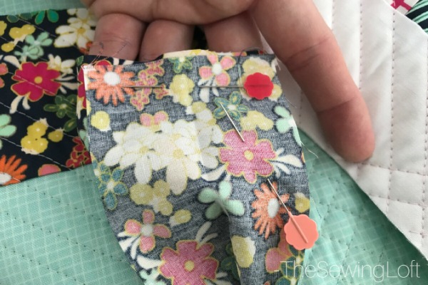 Learn how to create beautiful quilt binding with this simple DIY tip. Includes video tutorial to show you how to create this technique.