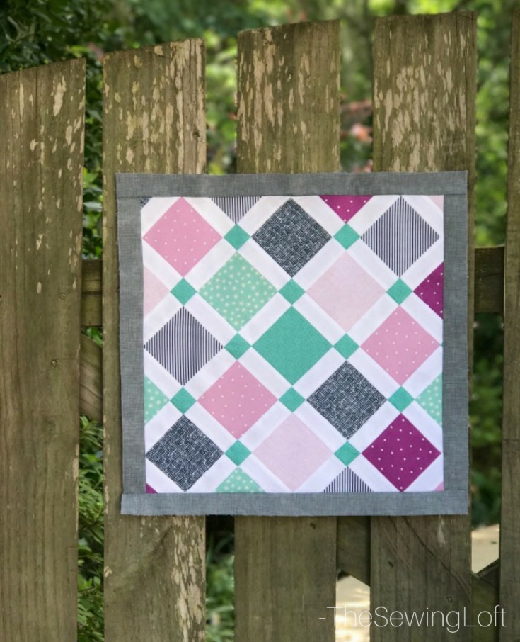 Expand your quilting knowledge while making something fun with the Quiltologie Urban Trellis mini quilt. Includes video how to for simple setting technique.