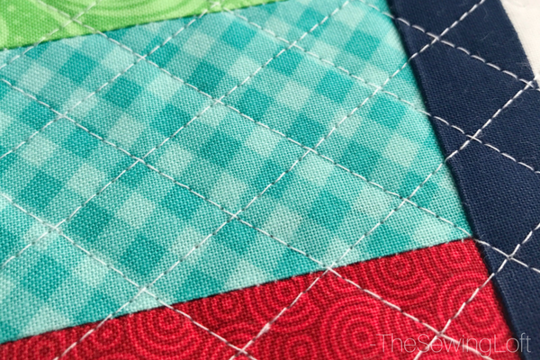 The laser guide beam on my machine made it so easy to quilt this pillow project. 