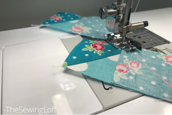 The laser beam guide makes it sew easy to create flying geese units needed for the devoted quilt block.  