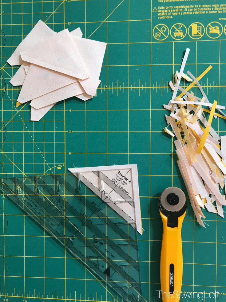 See how easy it is to make half square triangles with the clearly slotted ruler.