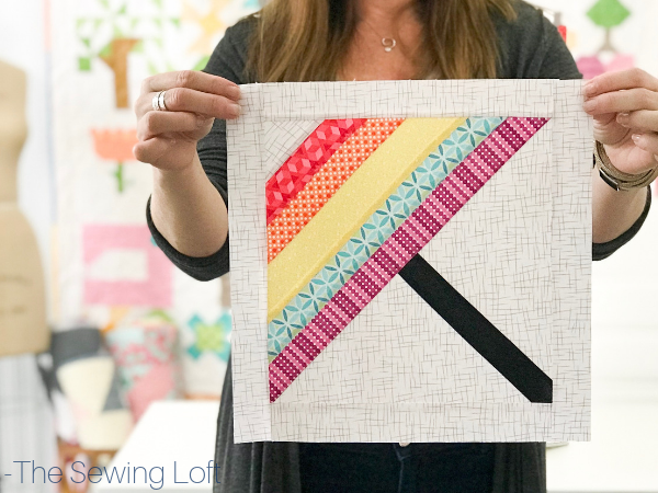 Stock up your pattern library while improving your quilting skills with the Blocks 2 Quilt series from The Sewing Loft. This Rainy Day Umbrella quilt block is bound to help keep away the weather blues. 