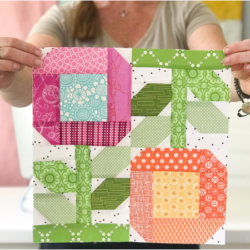 Add a splash of color to your next quilt with the Zinnia Flowers Quilt Block. Pattern includes 2 sizes. Block designed by The Sewing Loft