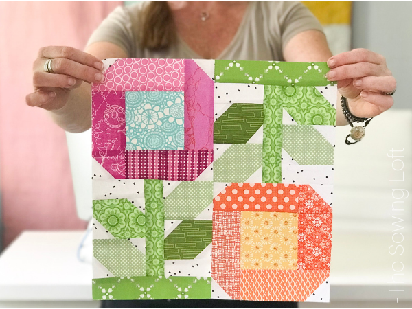 Add a splash of color to your next quilt with the Zinnia Flowers Quilt Block. Pattern includes 2 sizes. Block designed by The Sewing Loft