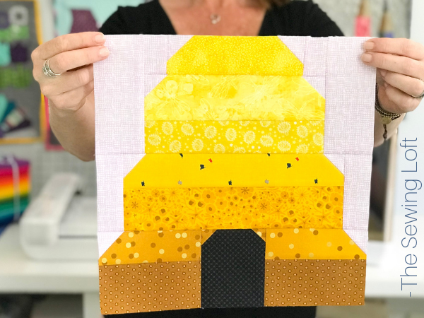 The patchwork construction of the Honeybee Hive quilt block makes it perfect for the beginner quilter and fun for the experienced quilter to play with their scraps. 