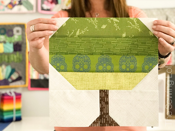 The simple patchwork construction of the Patchwork Tree quilt block makes it perfect for for quilters to play with their scraps. 