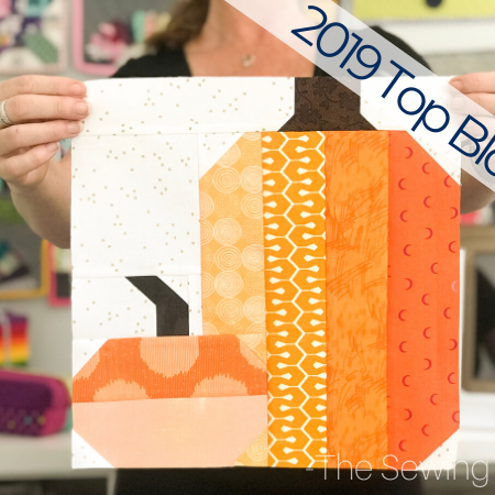 The simple patchwork construction of the Pretty Pumpkins quilt block makes it perfect for for quilters to play with their scraps.