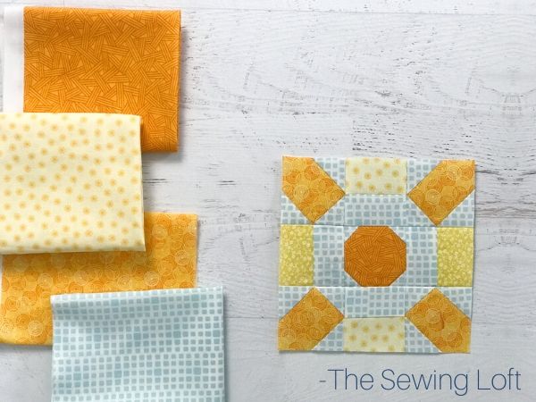 Pretty fabric scraps pulled to stitch up the Sunburst quilt block pattern by The Sewing Loft. Pattern is available in 2 sizes, is easy to make, and requires no special tools.