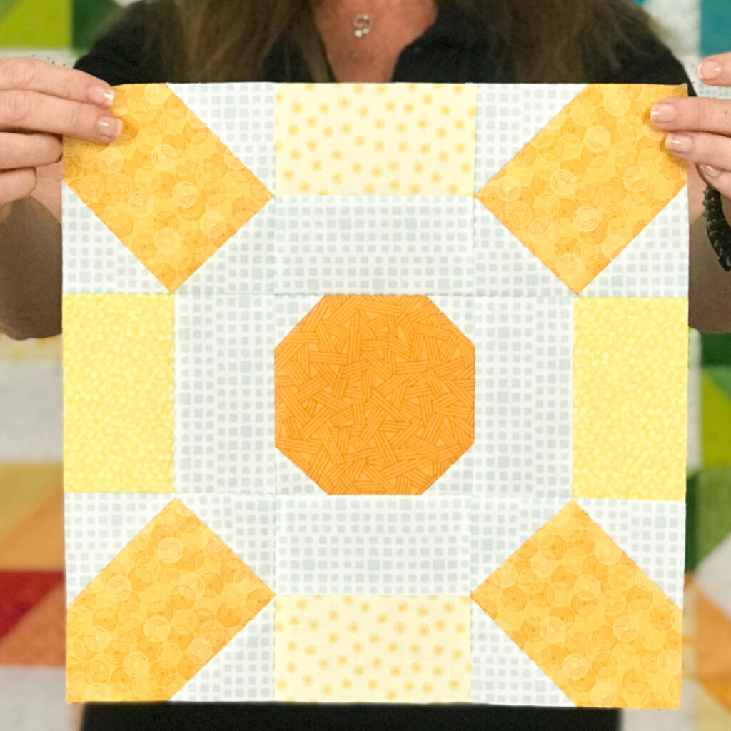 Turn your scraps into rays of sunshine with the Sunburst quilt block pattern by The Sewing Loft.