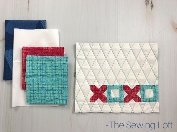 Skip the chocolate and make a sweet mini quilt for someone special this Valentine's Day. Free DIY pattern from The Sewing Loft.