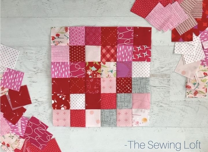 Scrappy red patchwork quilt blocks that I'm turning into a new quilt. Quilt pattern: Leader Board by The Sewing Loft.