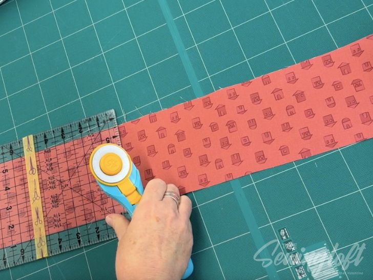 Cutting fabric for the Heart Mug quilt block by The Sewing Loft