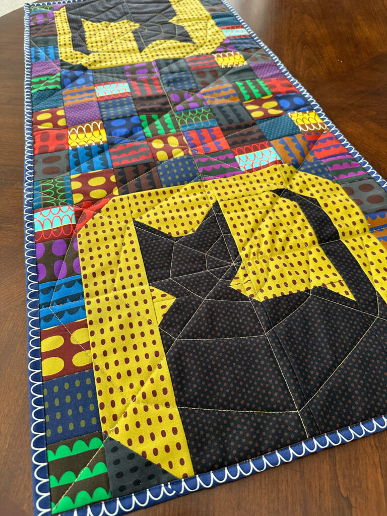 Silhouette Moon table runner featuring the Night Rainbow fabric collection from Deborah Fisher